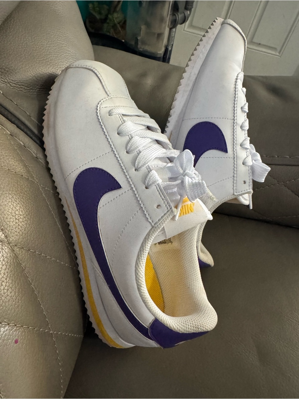Nike White Sneakers with Purple Swoosh and Yellow Accents